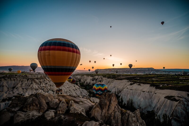 Hot Air Balloons at Sunrise — Orange, Serene, Photograph