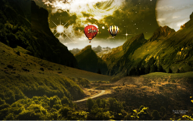 Hot air balloons in a mountain valley