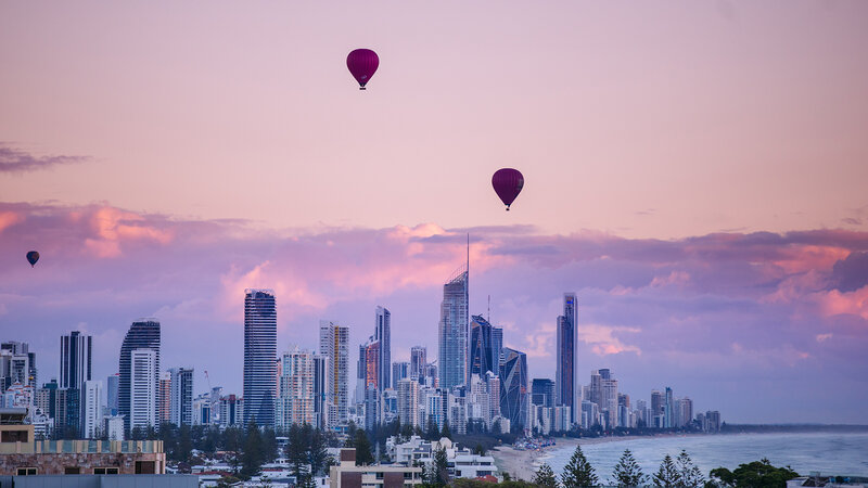 Hot Air Balloons over City — Pink