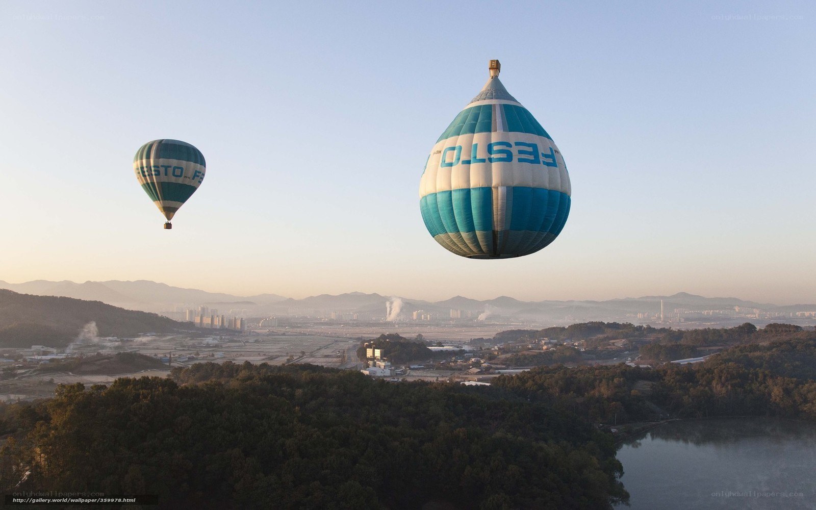Hot air balloons over city