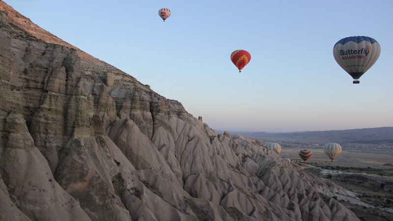 Hot Air Balloons over Cliffs — Blue