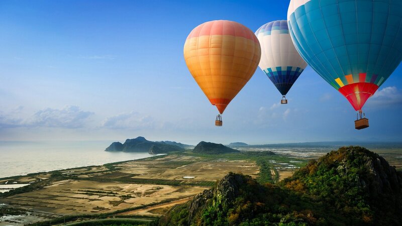 Hot Air Balloons over Coast — Blue, Serene, Morning, Photograph