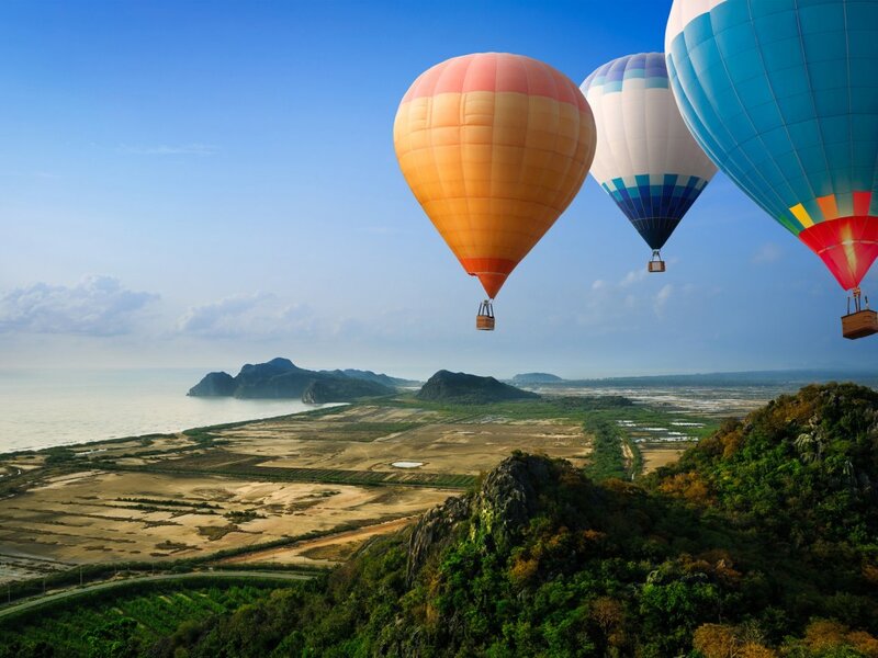 Hot Air Balloons over Coast — Blue, Serene