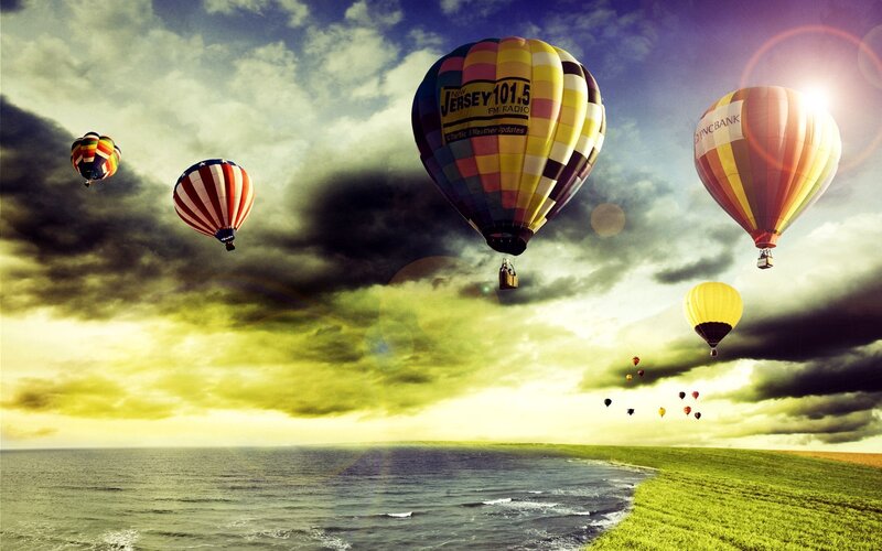 Hot air balloons over coast