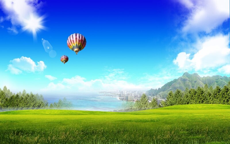 Hot air balloons over coastal city