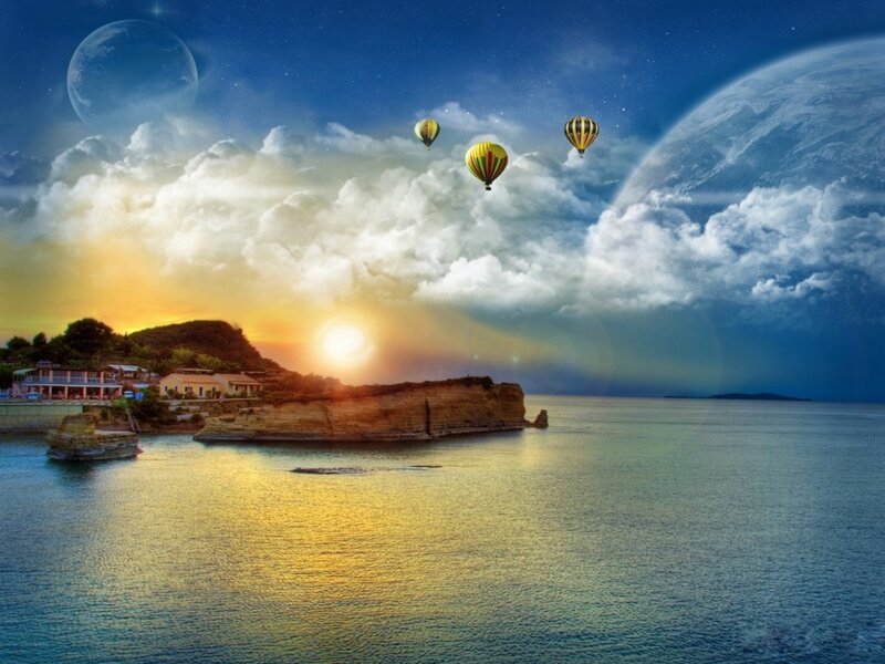 Hot air balloons over coastal sunset