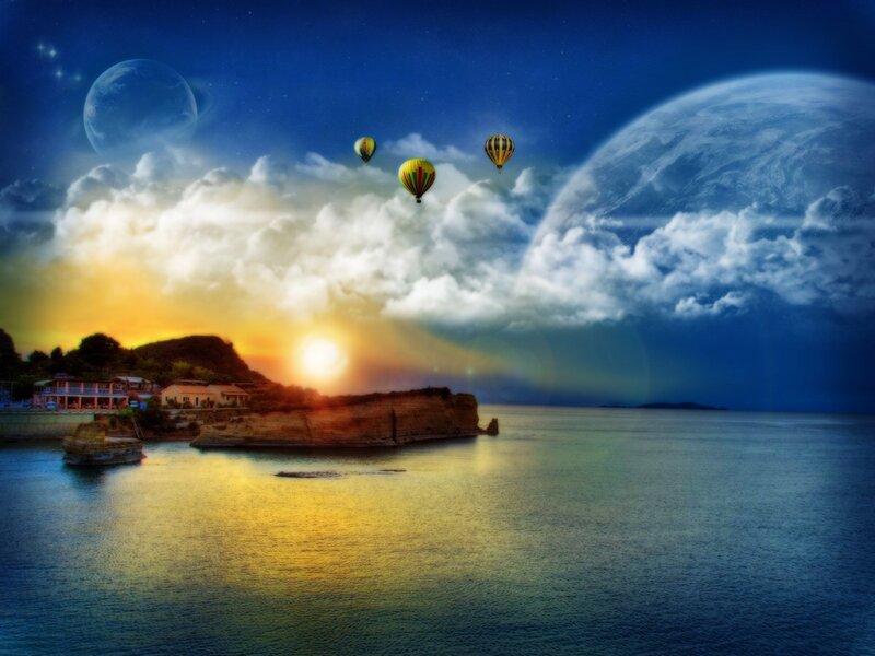 Hot air balloons over coastal sunset
