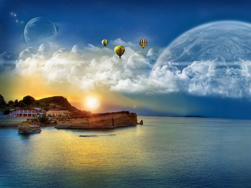 Hot air balloons over coastal sunset