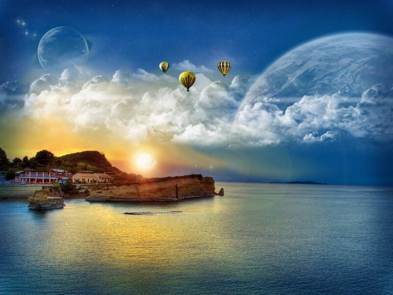 Hot air balloons over coastal sunset