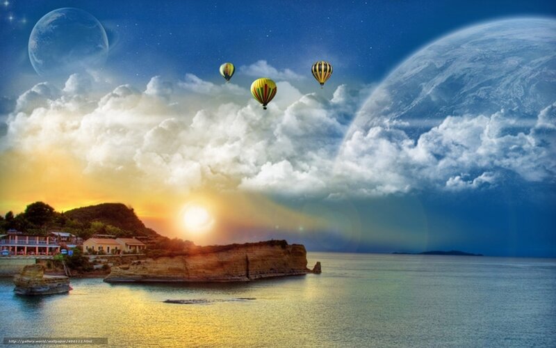 Hot air balloons over coastal town