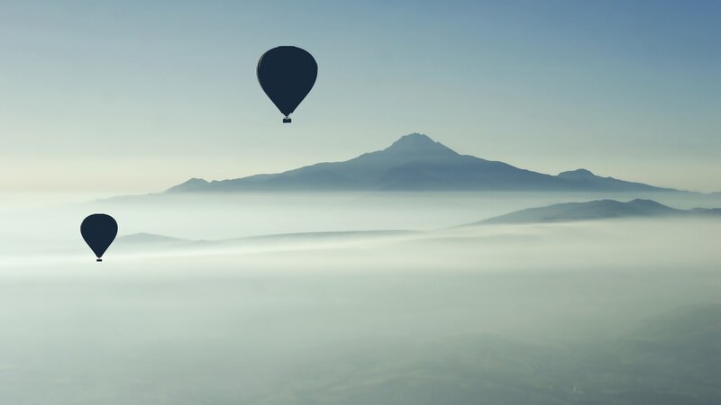 Hot Air Balloons over Fog — Blue, Serene, Morning