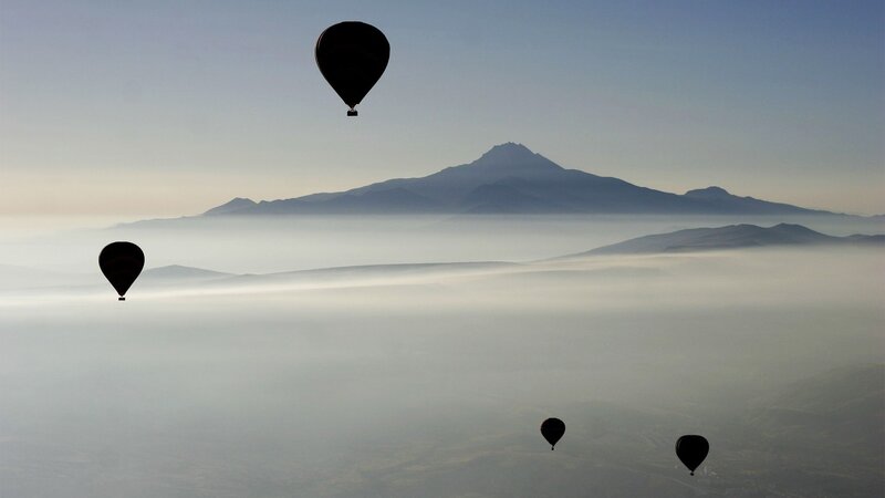 Hot Air Balloons over Fog — Gray