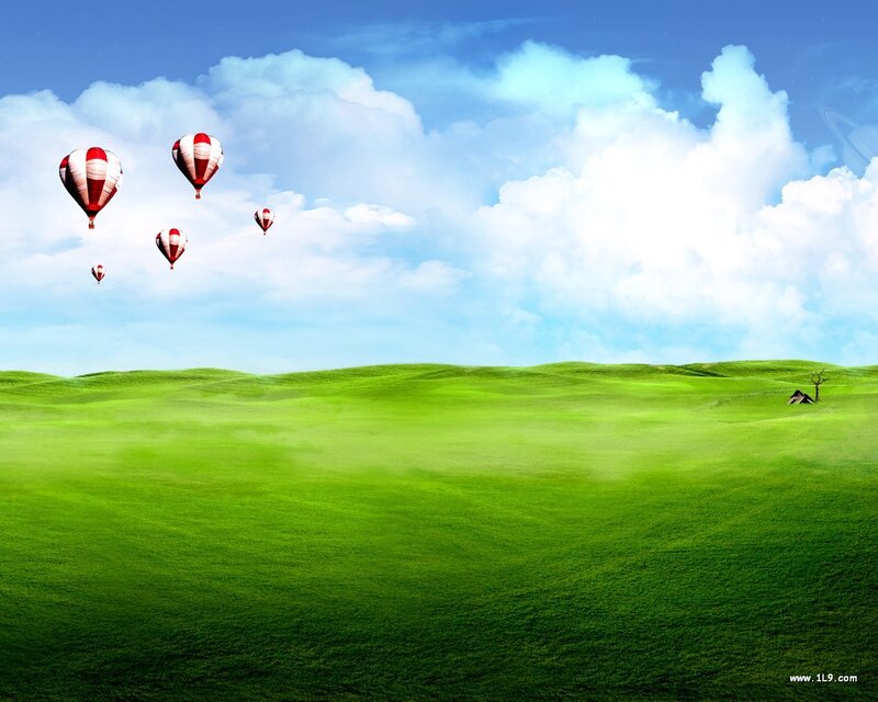 Hot air balloons over green hills