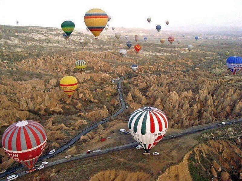 Hot Air Balloons over Landscape — Brown, Serene