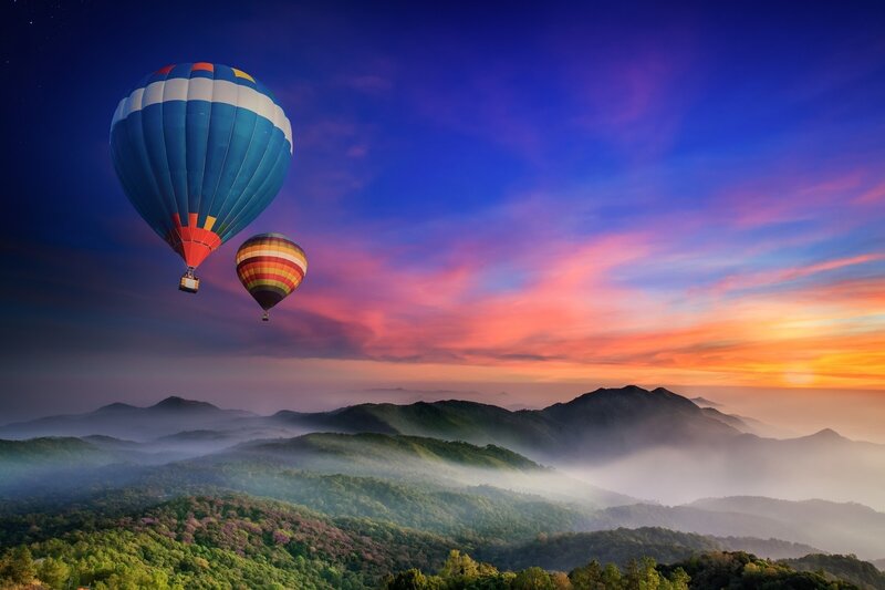 Hot Air Balloons over Mountains — Blue, Serene, Sunrise, Photograph, Clouds