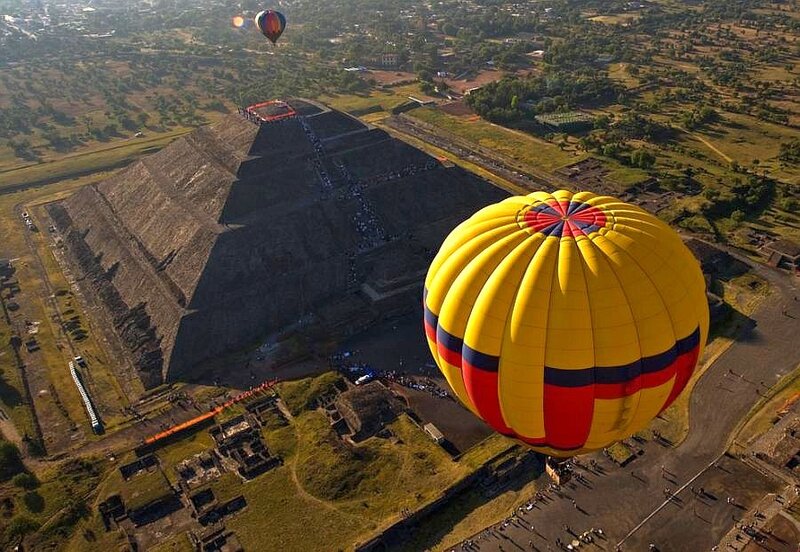Hot air balloons over pyramids