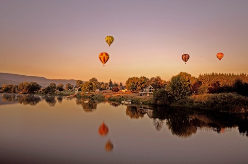 Hot Air Balloons over River — Orange