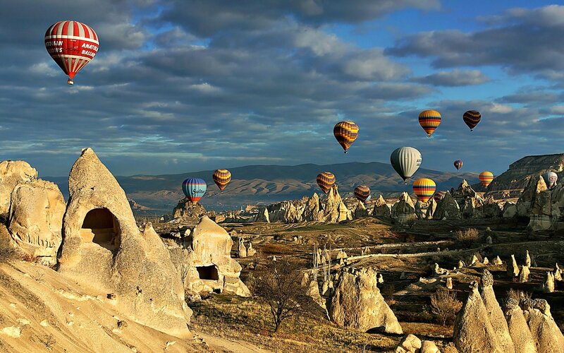 Hot Air Balloons over Rock Formations — Blue, Dramatic, Morning, Photograph, Rock Formations