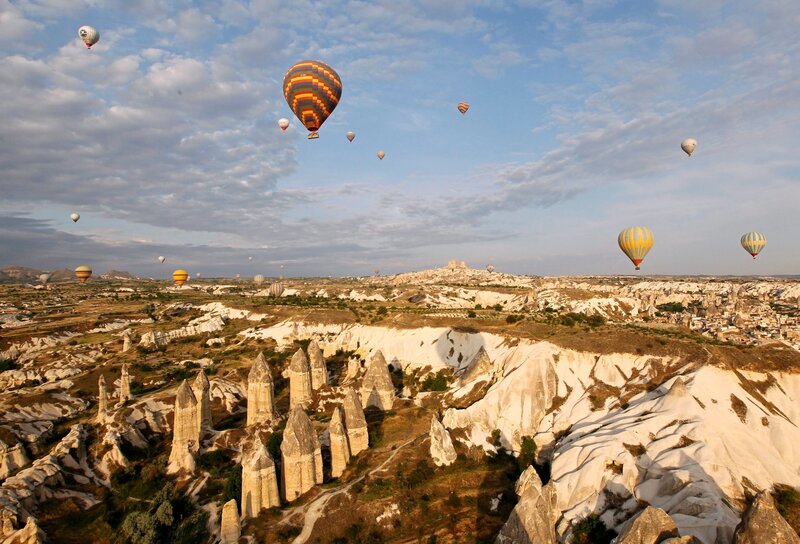 Hot Air Balloons over Rock Formations — Blue, Serene, Morning, Photograph