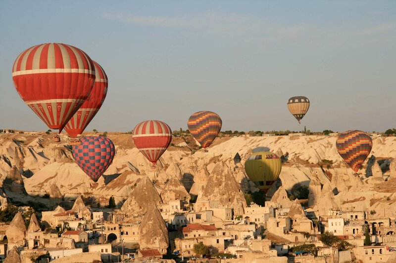 Hot Air Balloons over Rock Formations — Red, Serene