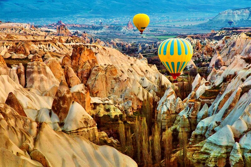 Hot Air Balloons over Rock Formations — Yellow