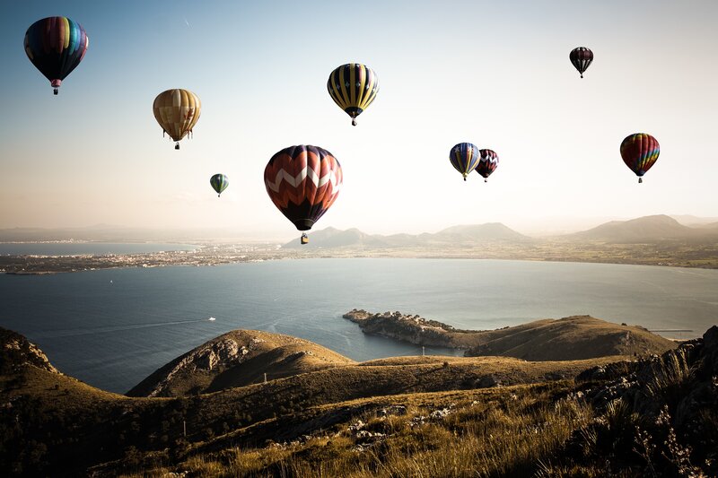 Hot Air Balloons over Sea — Blue, Serene
