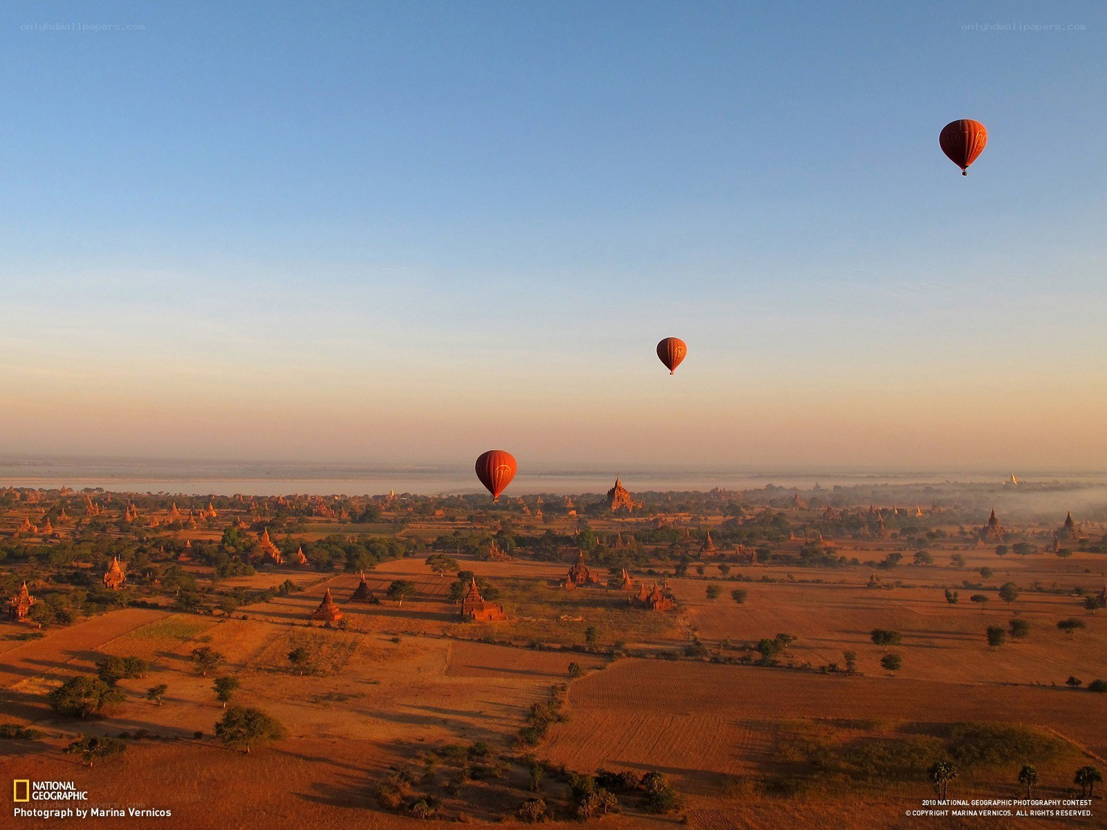 Hot air balloons over temples