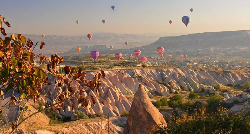 Hot Air Balloons over Valleys — Orange, Serene