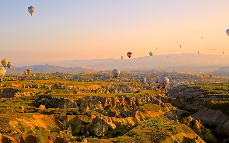 Hot Air Balloons over Valleys — Orange