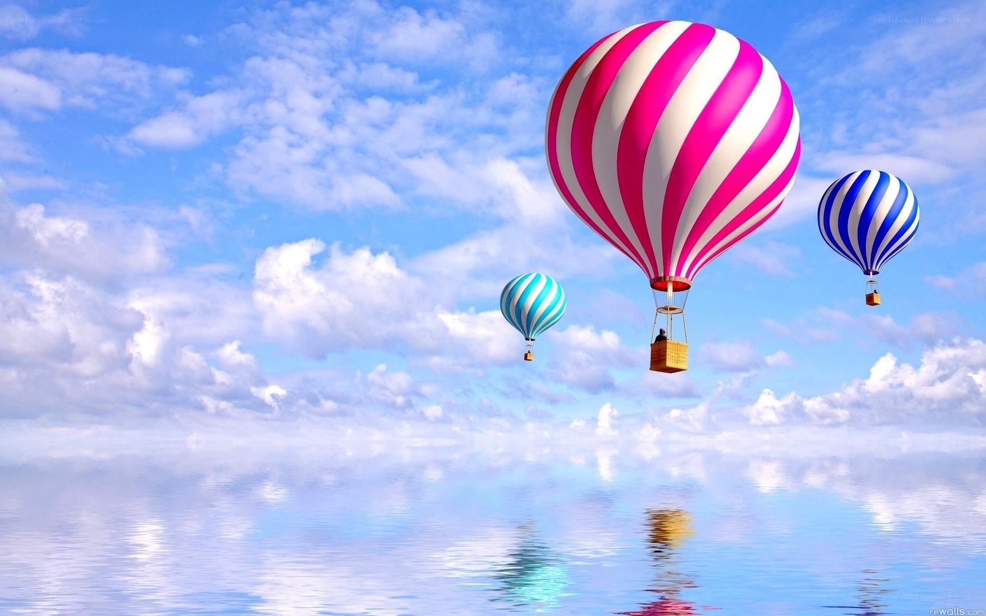 Hot air balloons over water