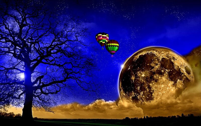 Hot air balloons under a giant moon