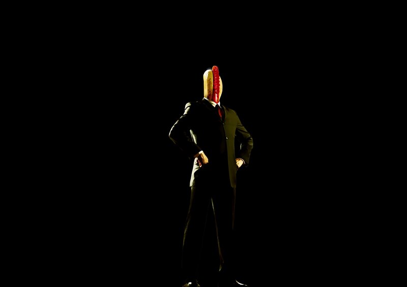 Hot dog-headed man in suit