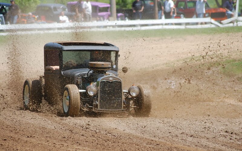 Hot rod racing on dirt track