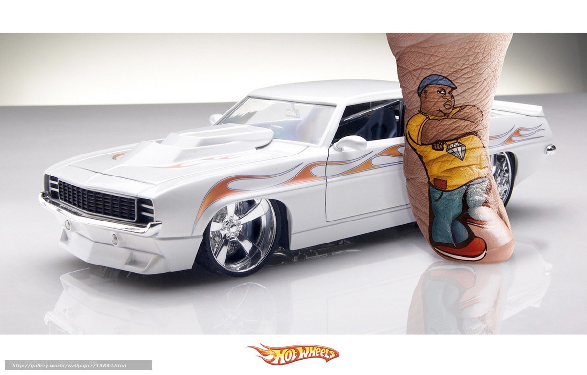 Hot Wheels car with tattooed foot
