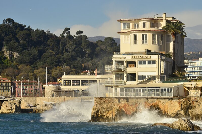 Hotel by the sea with crashing waves