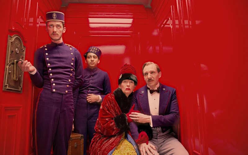 Hotel lobby staff in red elevator