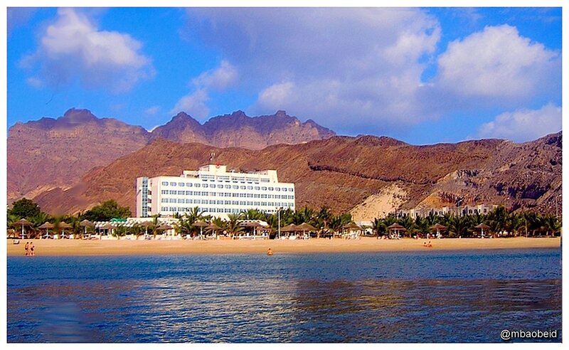 Hotel on Beach with Mountains