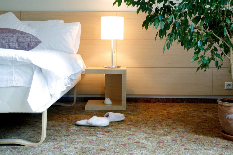 Hotel room with bed and lamp