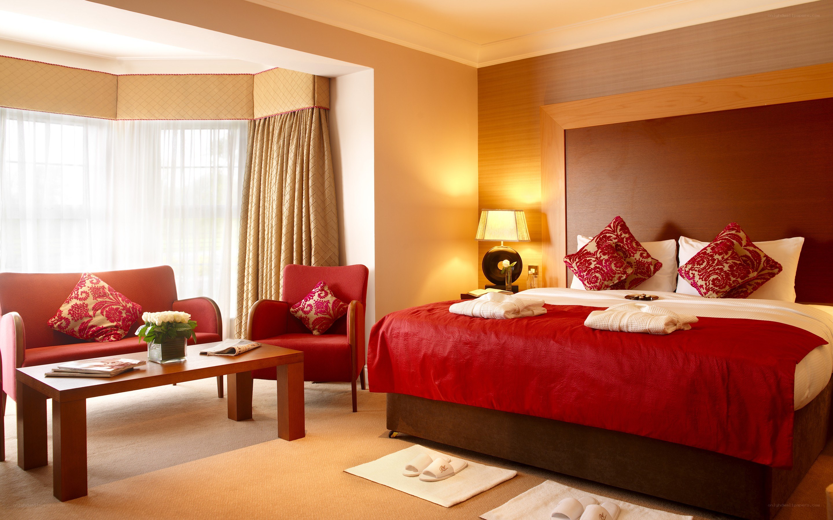 hotel room with red bedding