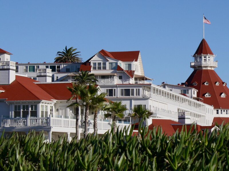 Hotel with red roof and palm trees