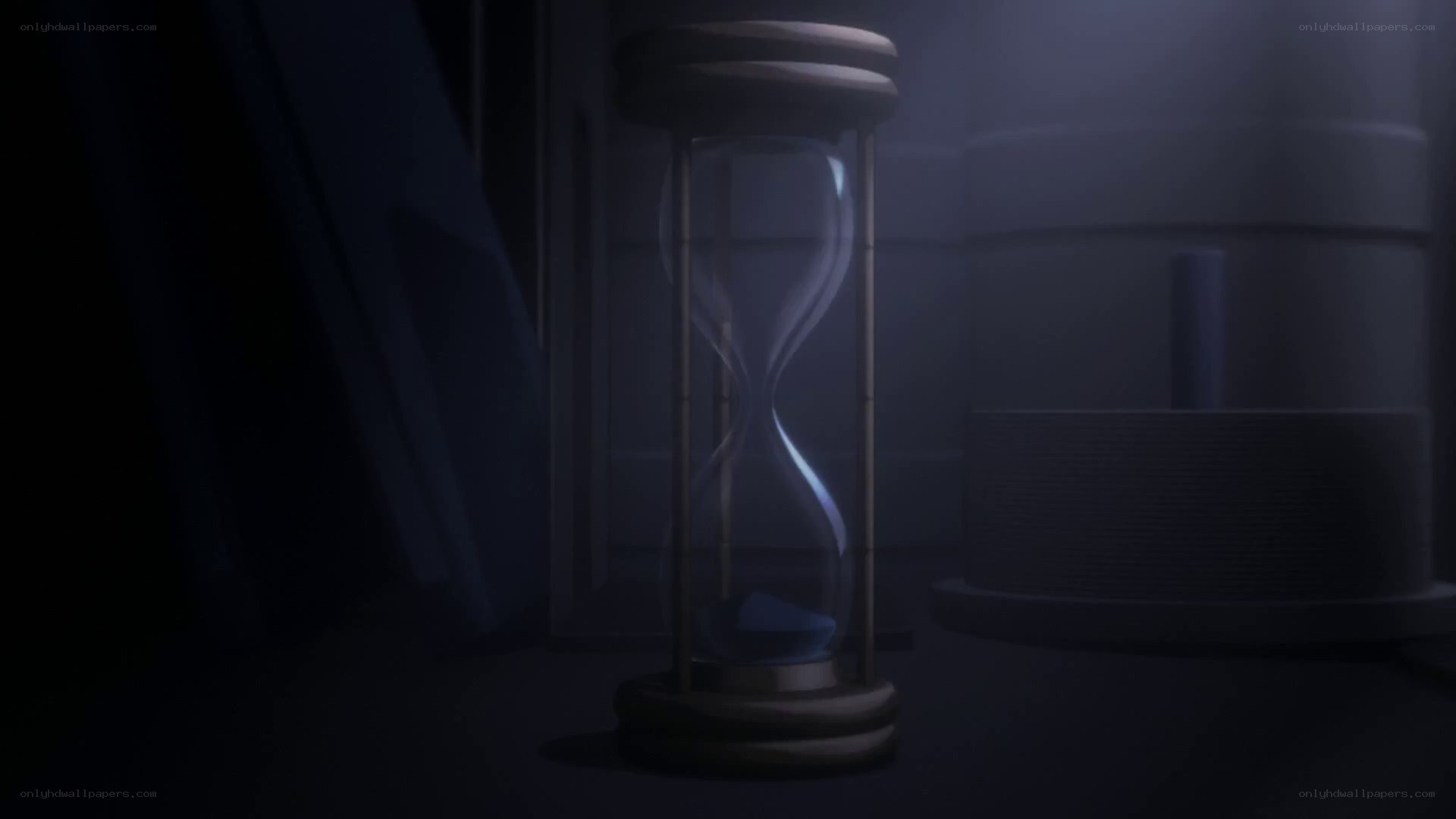 hourglass in a dark room