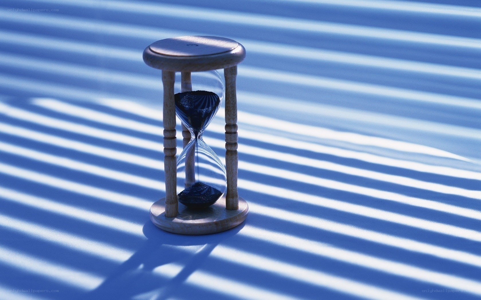 Hourglass in striped light
