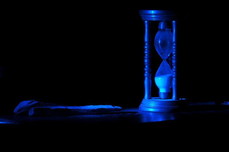 Hourglass on Dark Surface