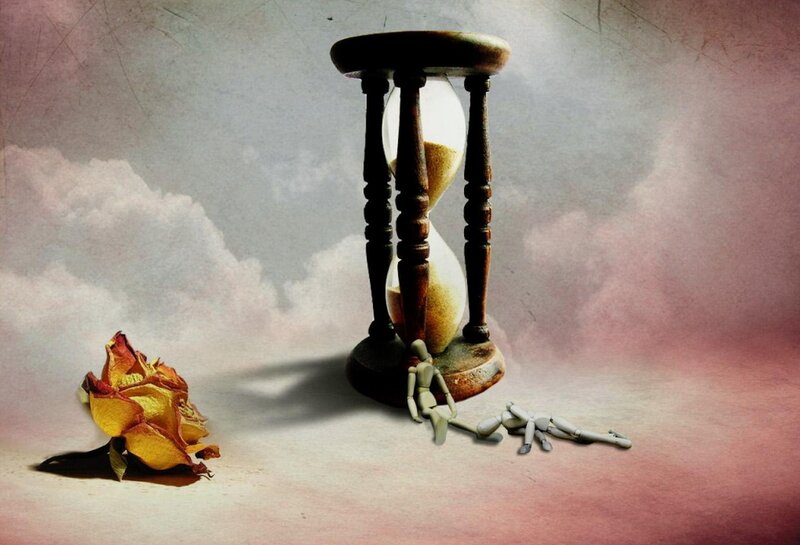 Hourglass with dried rose