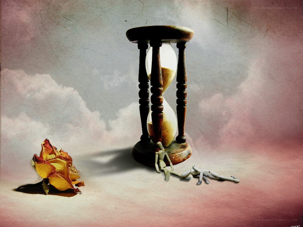 Hourglass with dried rose