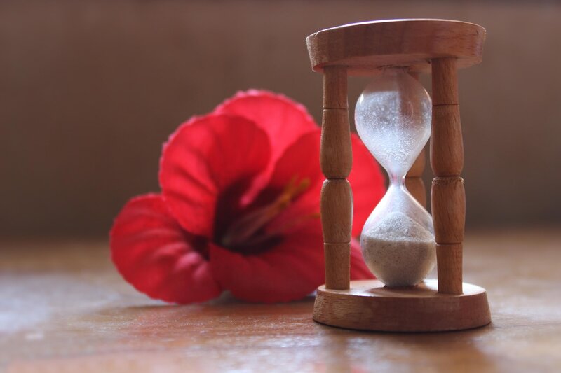Hourglass with Red Flower