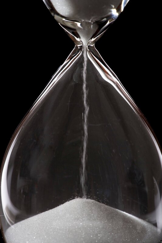 hourglass with sand falling