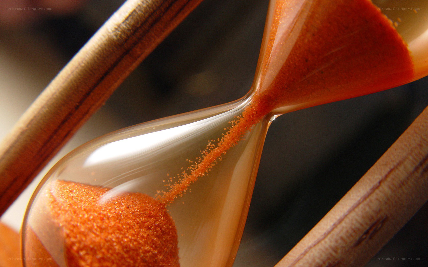 hourglass with sand flowing