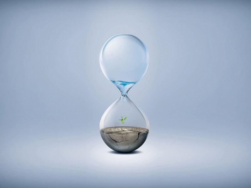 Hourglass with sprout and water
