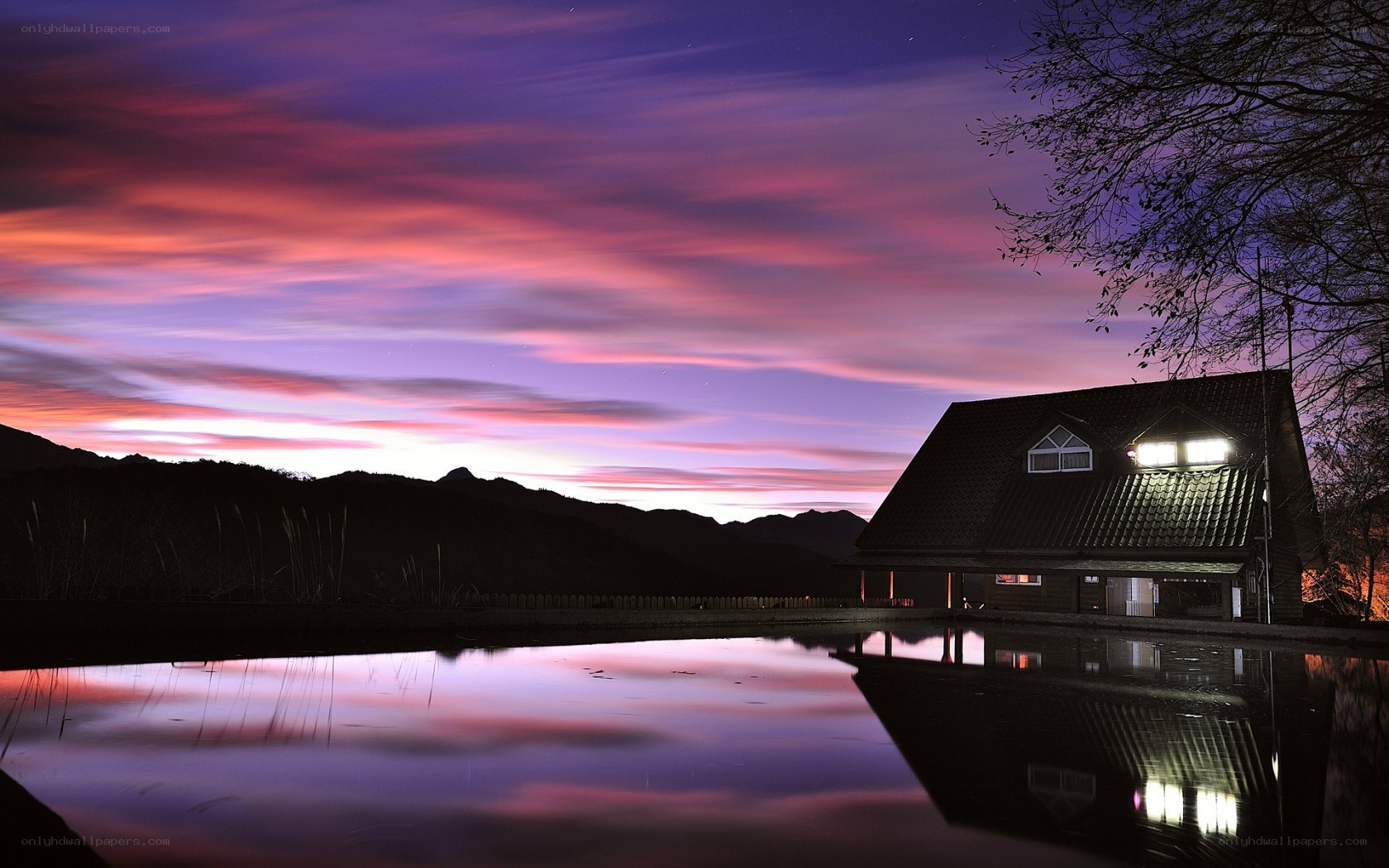 House at dusk by the lake